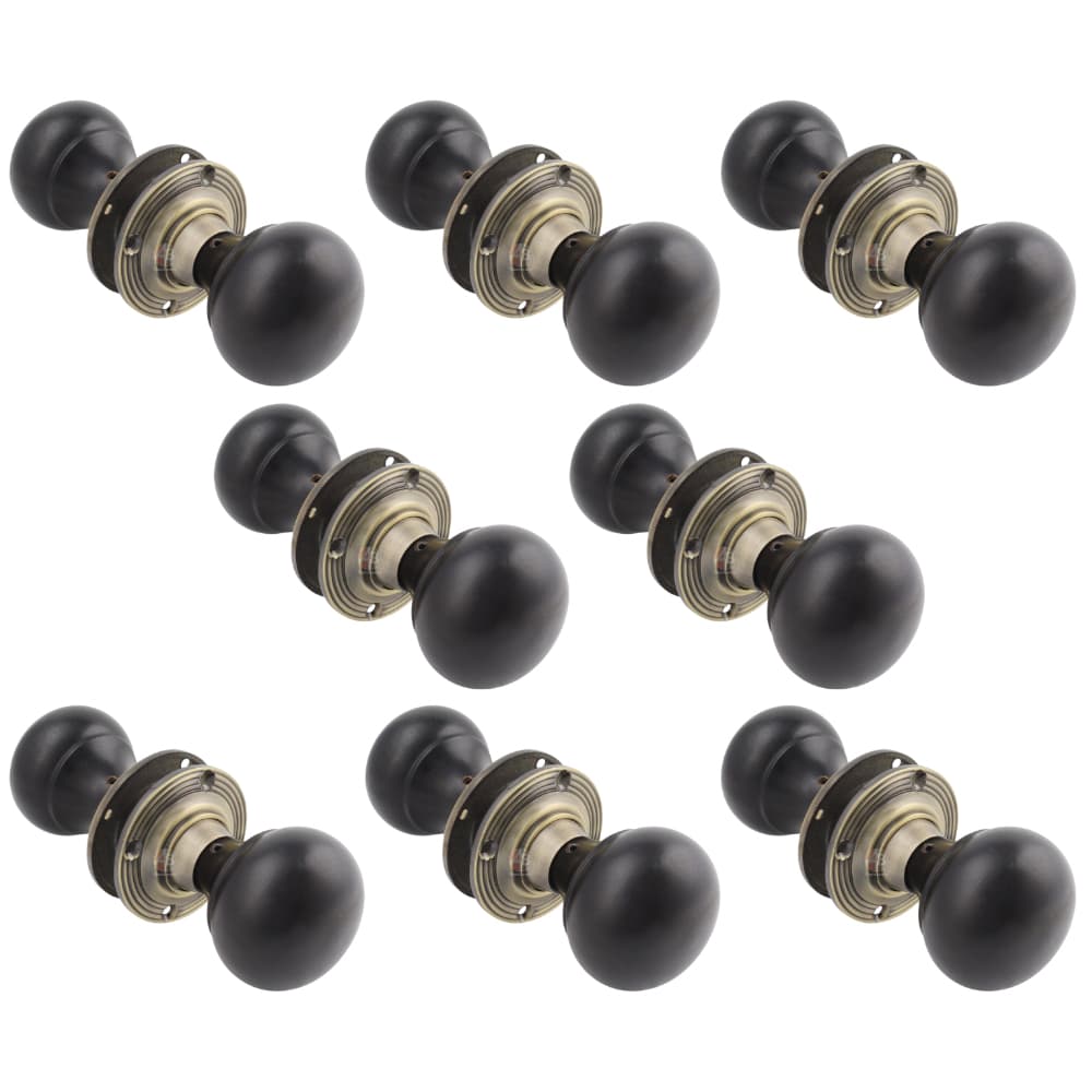 8 Pairs of Ebony & Antique Brass Bun Door Knobs