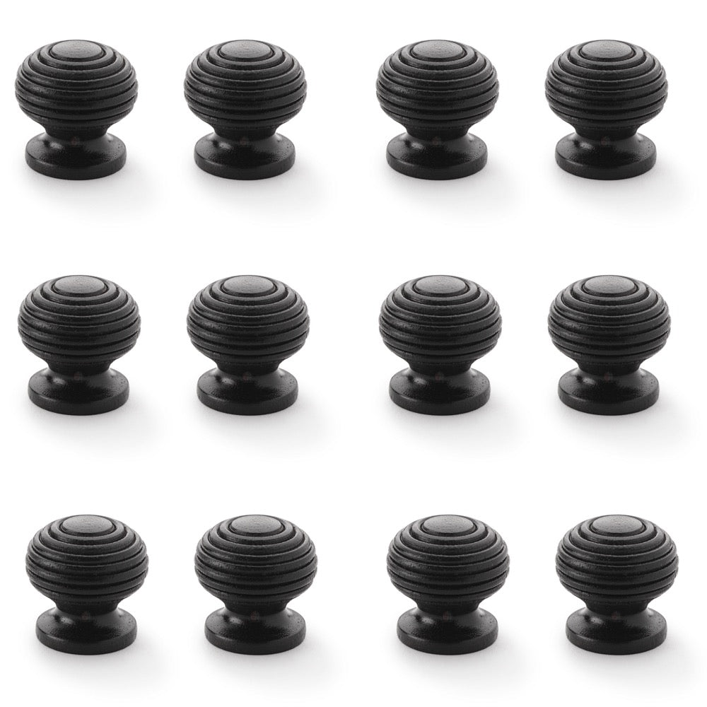 12 small ebonised beehive cupboard door knobs